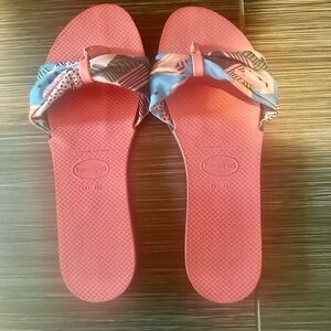 Floral flip flops wore once